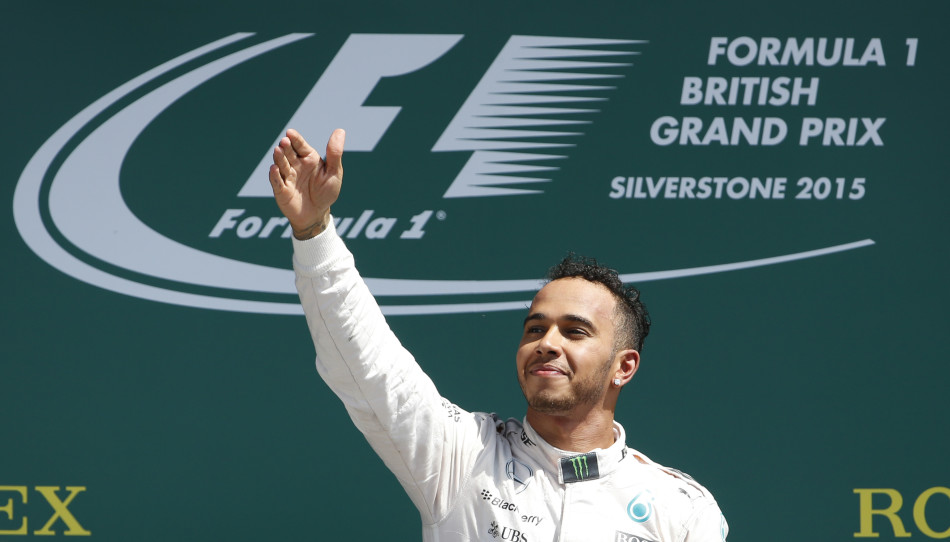 Formula One - F1 - British Grand Prix 2015 - Silverstone, England - 5/7/15 Mercedes' Lewis Hamilton celebrates his win on the podium Reuters / Phil Noble