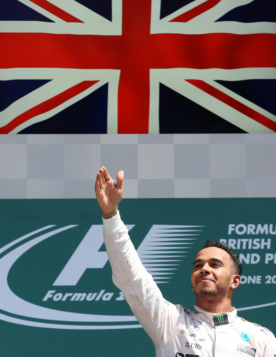 Formula One - F1 - British Grand Prix 2015 - Silverstone, England - 5/7/15 Mercedes' Lewis Hamilton celebrates his win on the podium Reuters / Paul Childs