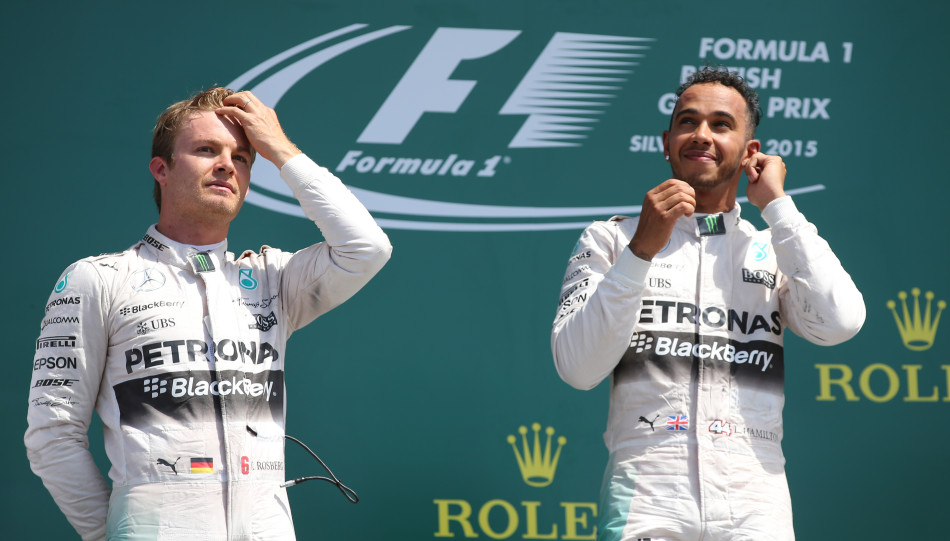 Formula One - F1 - British Grand Prix 2015 - Silverstone, England - 5/7/15 Mercedes' Lewis Hamilton celebrates his win on the podium with Nico Rosberg (L) Reuters / Paul Childs