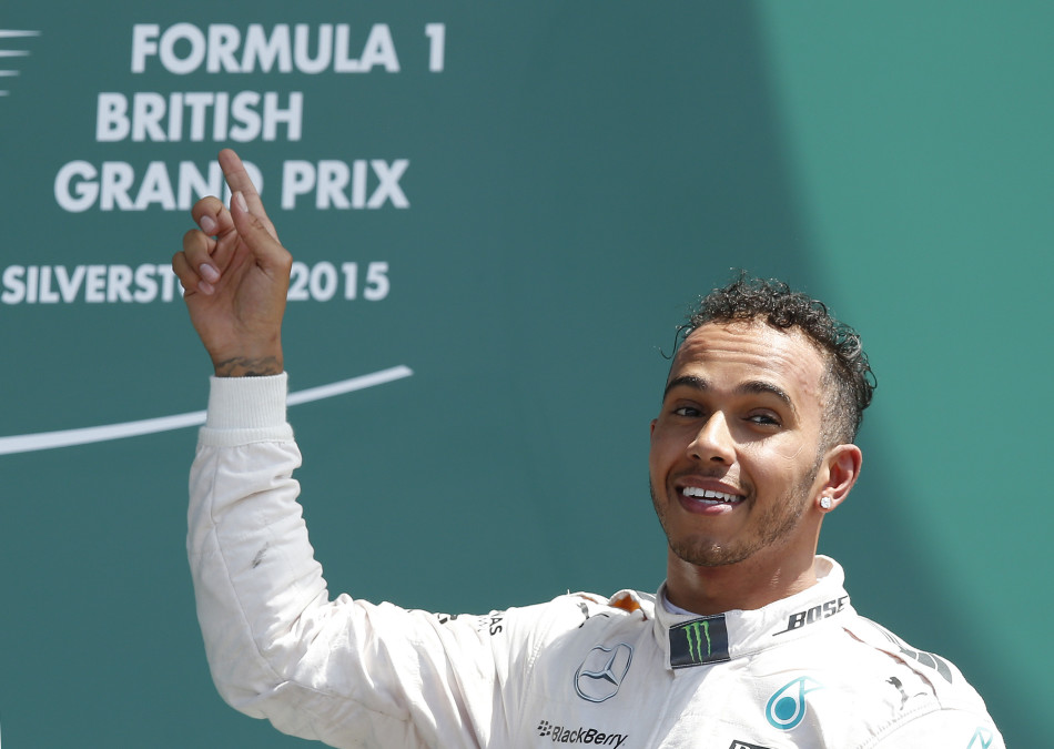 Formula One - F1 - British Grand Prix 2015 - Silverstone, England - 5/7/15 Mercedes' Lewis Hamilton celebrates his win on the podium Reuters / Andrew Yates