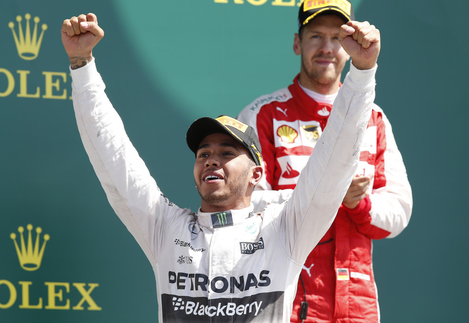 Formula One - F1 - British Grand Prix 2015 - Silverstone, England - 5/7/15 Mercedes' Lewis Hamilton celebrates his win on the podium Reuters / Andrew Yates